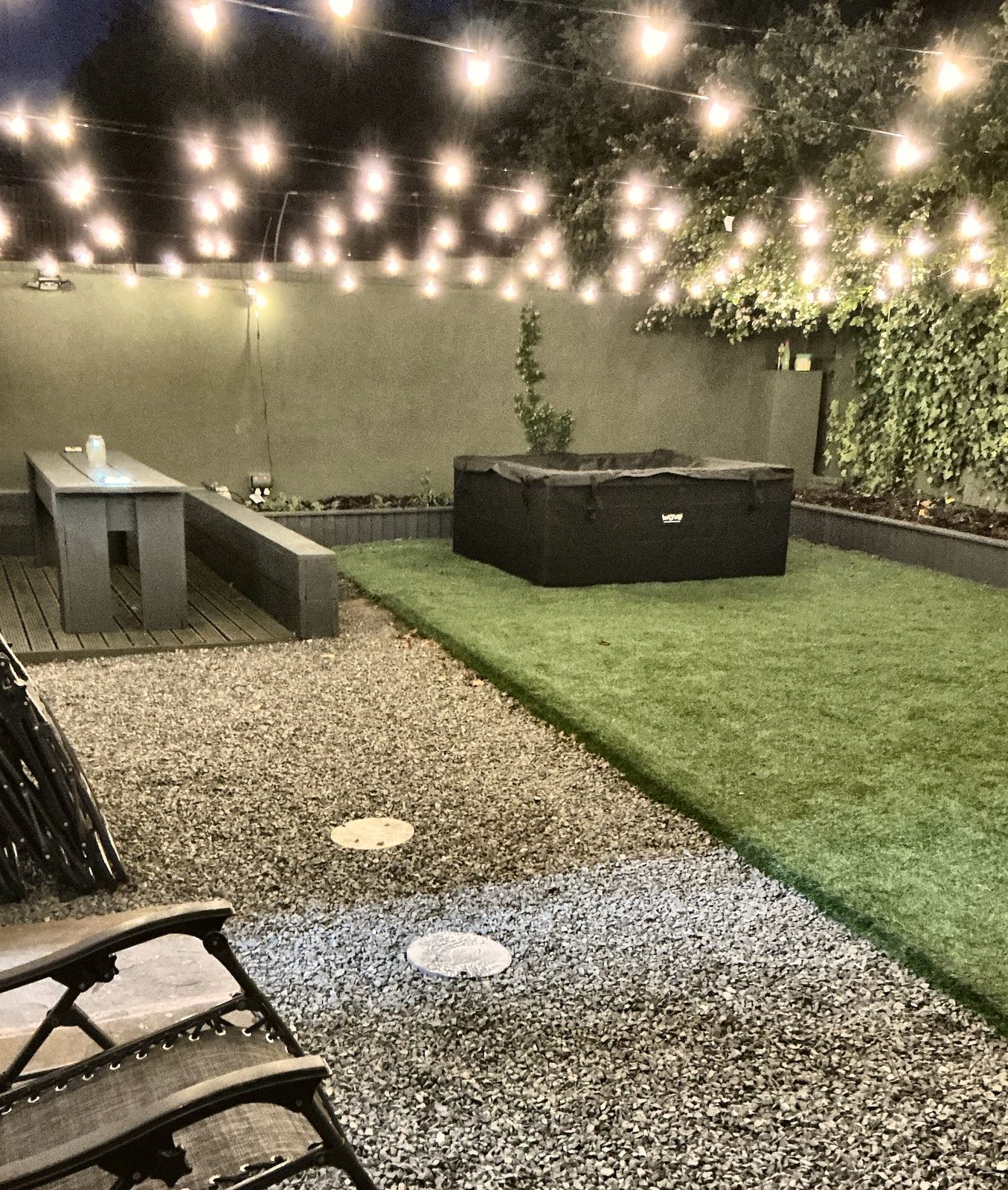Garden with festoon lights in the evening